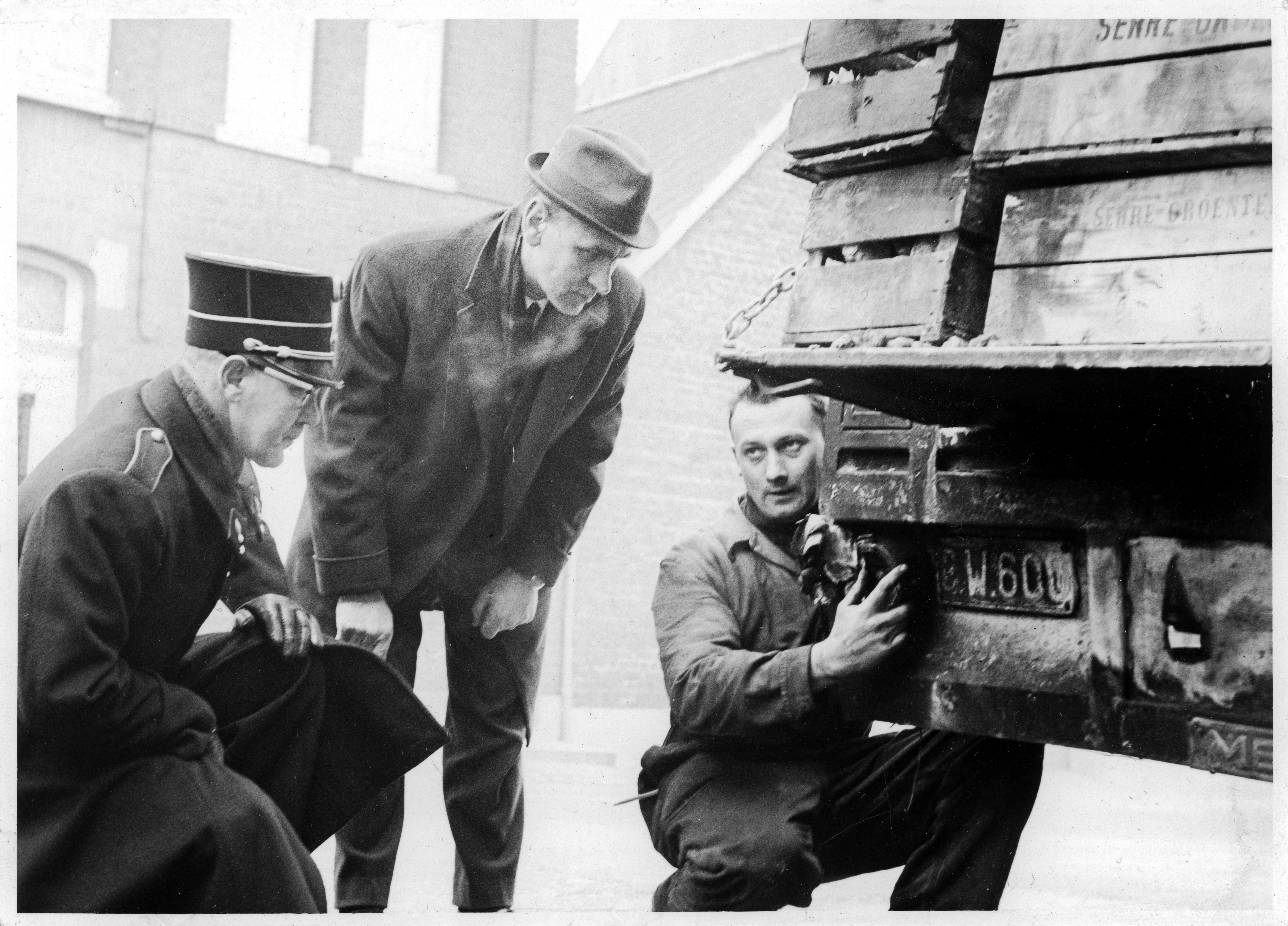 The man with the hat.